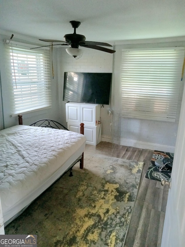 bedroom featuring ceiling fan and wood finished floors