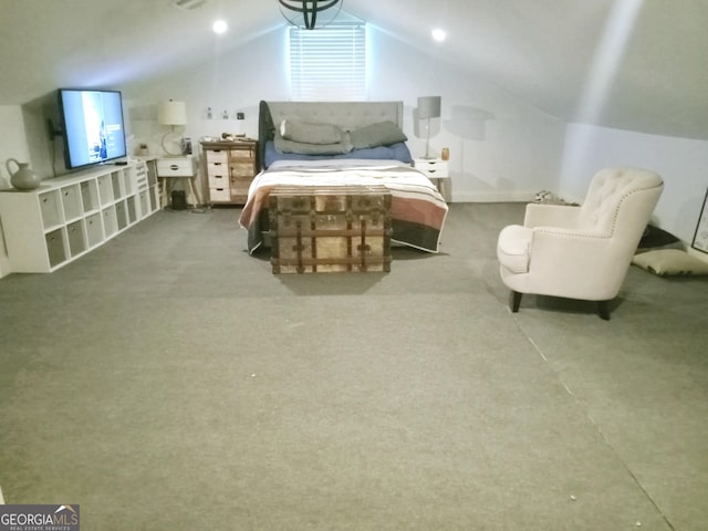 bedroom with light colored carpet, vaulted ceiling, and visible vents