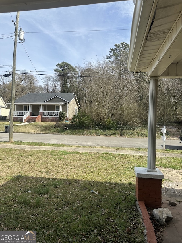 view of yard featuring a porch