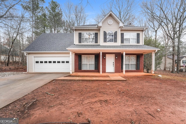 view of front of house with a shingled roof, concrete driveway, an attached garage, covered porch, and brick siding