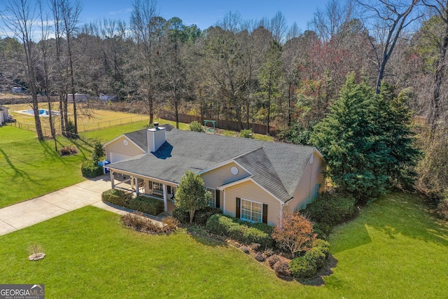 aerial view with a wooded view