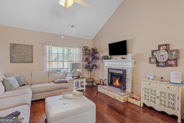 living area featuring ceiling fan, high vaulted ceiling, dark wood-style flooring, a fireplace, and visible vents