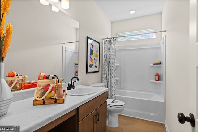 full bathroom featuring wood finished floors, vanity, toilet, and shower / bath combo with shower curtain