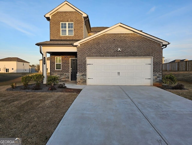 craftsman-style home with a garage, brick siding, fence, concrete driveway, and stone siding