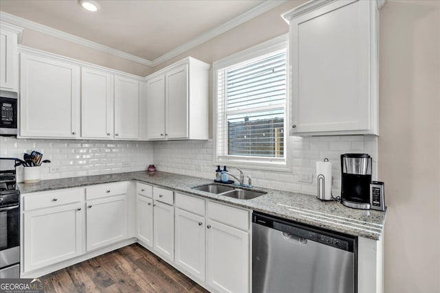 kitchen with dark wood-style flooring, stainless steel appliances, crown molding, white cabinetry, and a sink