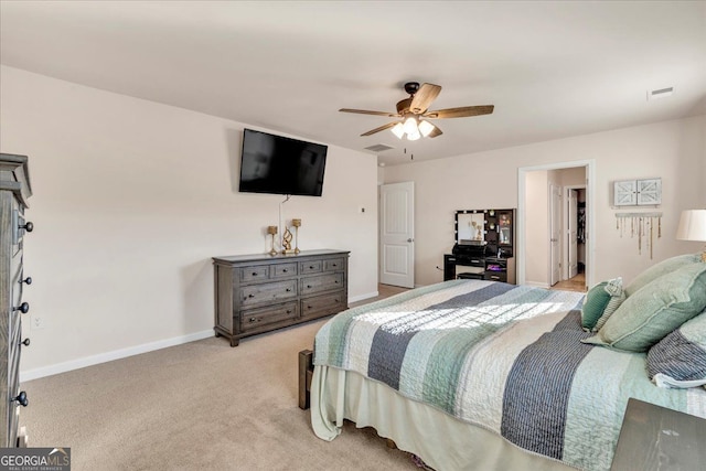 bedroom featuring a ceiling fan, light colored carpet, visible vents, and baseboards