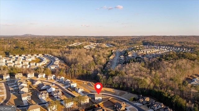 bird's eye view with a forest view and a residential view