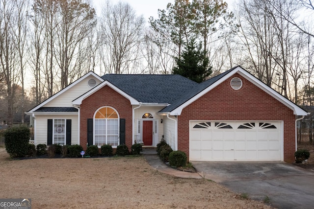 ranch-style house with a garage, concrete driveway, brick siding, and a shingled roof