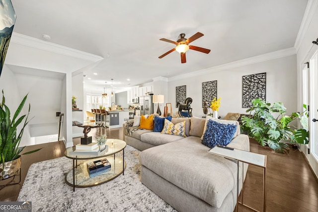 living area featuring ceiling fan, recessed lighting, dark wood-style flooring, baseboards, and crown molding