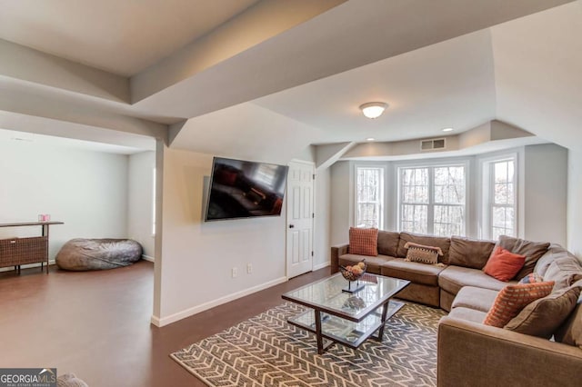 living room with baseboards and visible vents