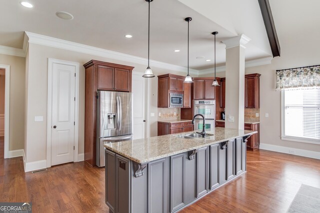 5016 Deer Creek Ct, Flowery Branch, GA 30542 - kitchen with appliances with stainless steel finishes, tasteful backsplash, wood finished floors, crown molding, and recessed lighting