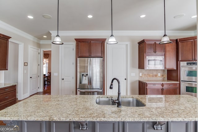 kitchen with appliances with stainless steel finishes, ornamental molding, a sink, light stone countertops, and backsplash