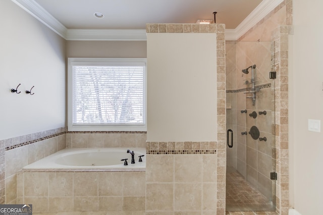 full bathroom featuring a shower stall, a garden tub, and crown molding