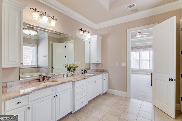 5016 Deer Creek Ct, Flowery Branch, GA 30542 - bathroom with ornamental molding, double vanity, tile patterned floors, ceiling fan, and a tub