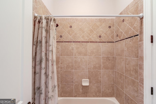 full bath featuring shower / bath combo with shower curtain