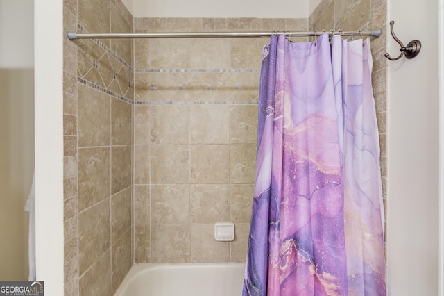 bathroom with shower / tub combo with curtain