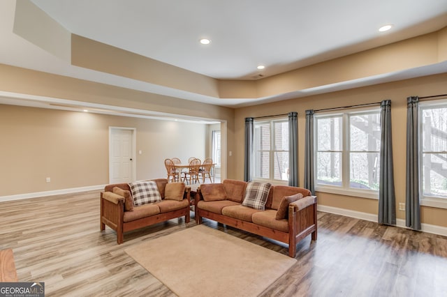 5016 Deer Creek Ct, Flowery Branch, GA 30542 - living room with light wood-type flooring, recessed lighting, and a raised ceiling