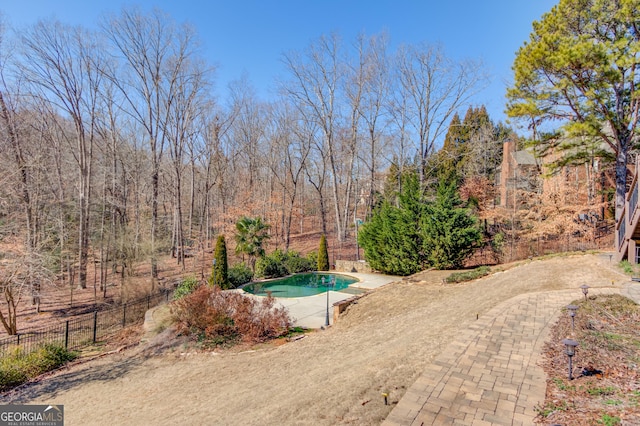 view of pool with fence and a fenced in pool