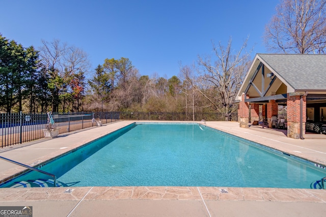 view of pool featuring a fenced in pool, a patio, and fence