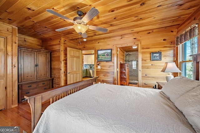 bedroom with wooden ceiling, wooden walls, and light wood finished floors