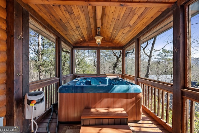 sunroom featuring wood ceiling, vaulted ceiling, and a jacuzzi