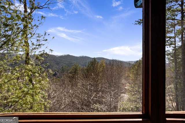 view of mountain feature featuring a view of trees