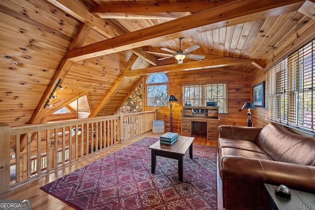 living room featuring vaulted ceiling with beams, wooden ceiling, wood finished floors, and wood walls