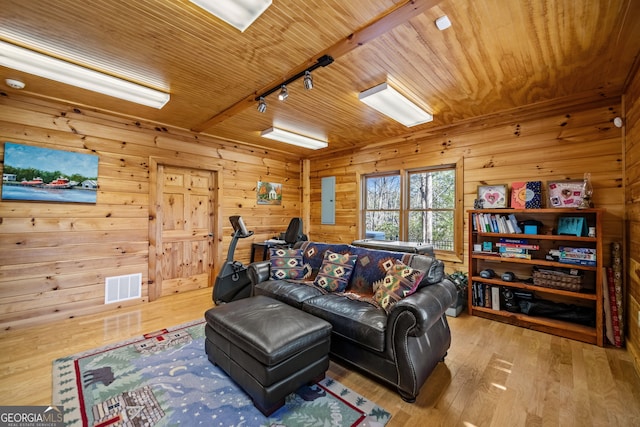 living area with wood ceiling, light wood-type flooring, rail lighting, and visible vents