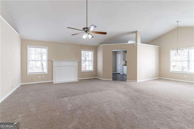 unfurnished living room with lofted ceiling, carpet floors, ceiling fan, and baseboards