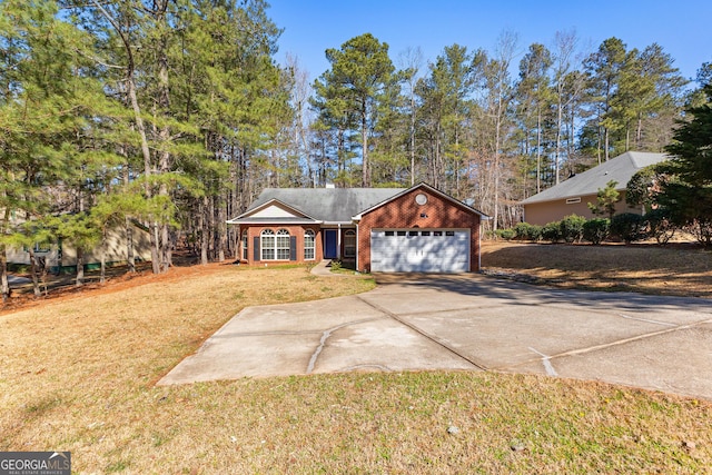 view of front of home featuring a garage, driveway, brick siding, and a front lawn