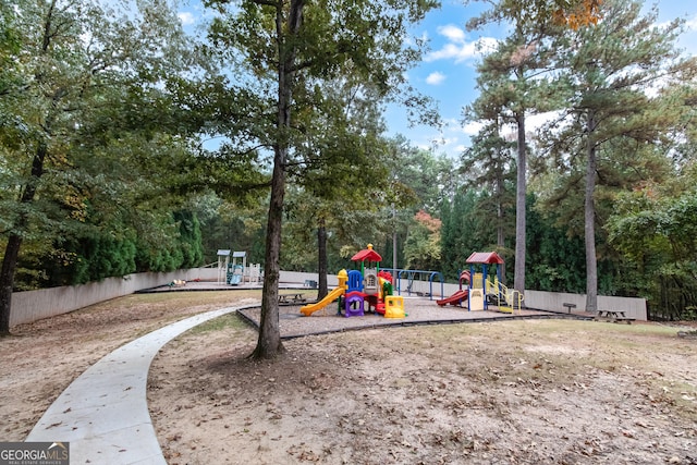 communal playground featuring fence