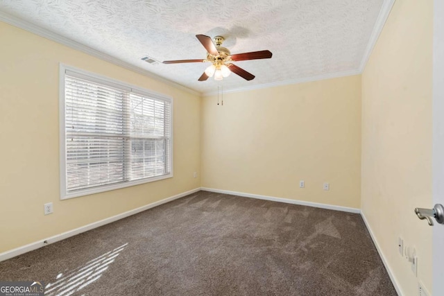 carpeted empty room featuring a textured ceiling, ornamental molding, and visible vents