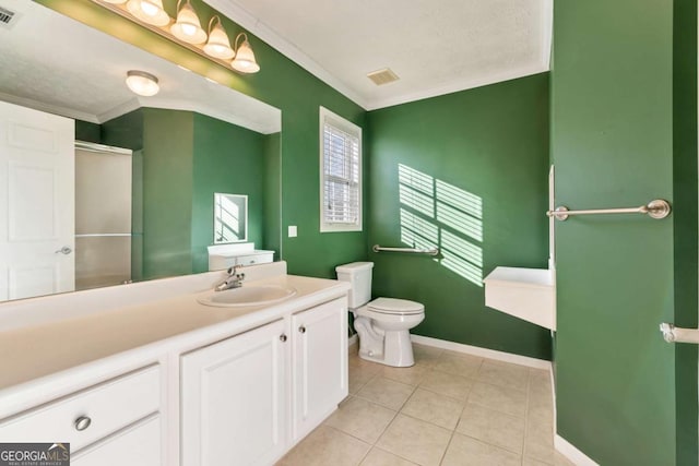 bathroom with ornamental molding, visible vents, and vanity