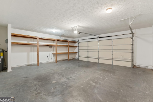 garage with a garage door opener and electric water heater