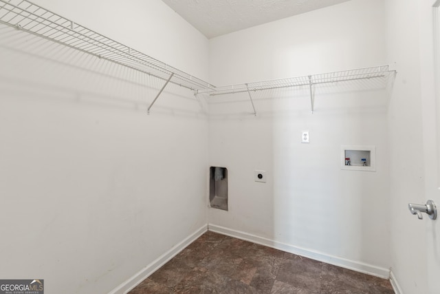 clothes washing area with laundry area, hookup for a washing machine, electric dryer hookup, and baseboards