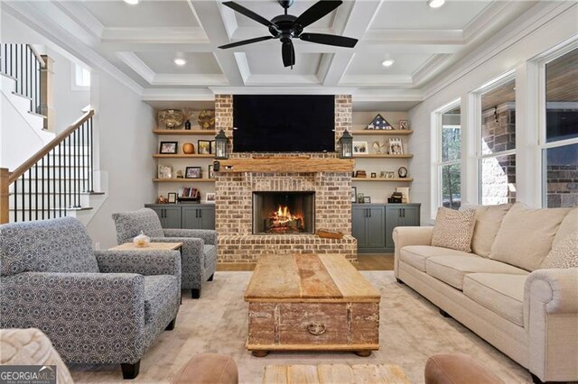 living room with beamed ceiling, stairway, and coffered ceiling