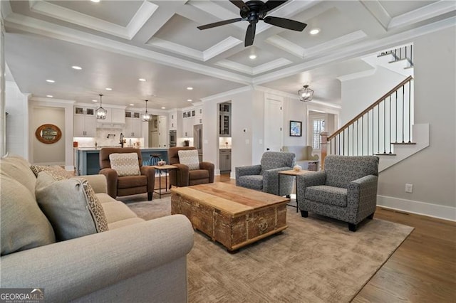 6326 Point Twenty Two, Gainesville, GA 30506 - living area with crown molding, a ceiling fan, light wood-style floors, and coffered ceiling