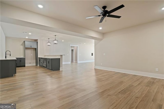 6326 Point Twenty Two, Gainesville, GA 30506 - unfurnished living room with recessed lighting, light wood-style flooring, and baseboards