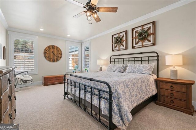 carpeted bedroom with multiple windows, baseboards, and crown molding