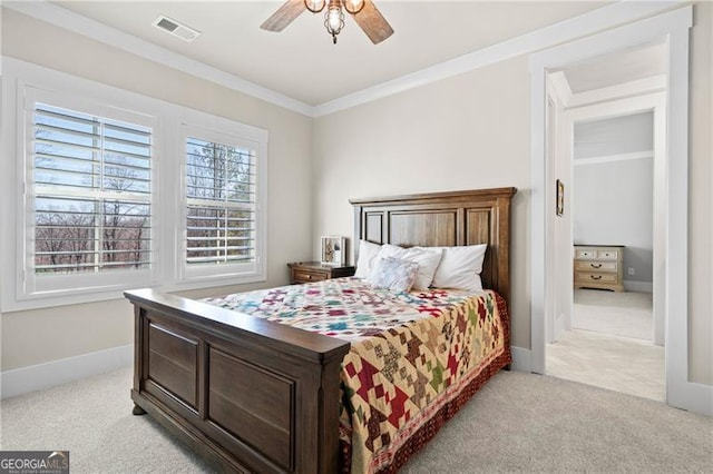 bedroom with carpet floors, visible vents, crown molding, and baseboards