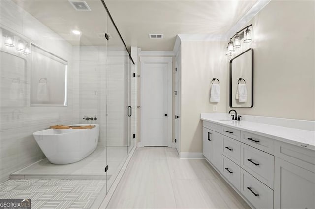6326 Point Twenty Two, Gainesville, GA 30506 - bathroom with vanity, a soaking tub, visible vents, and a stall shower