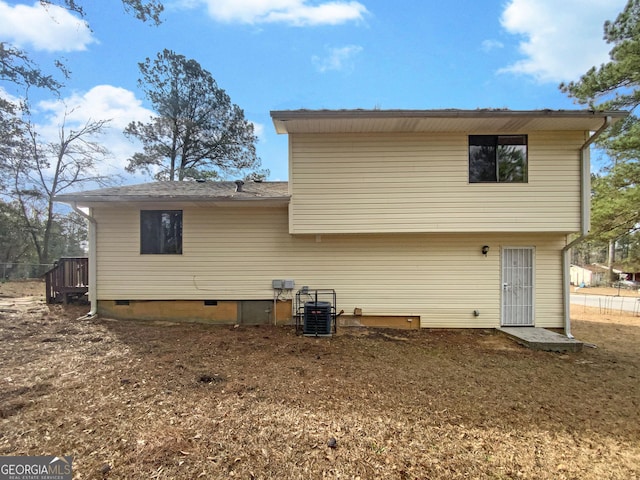 back of property with crawl space and cooling unit