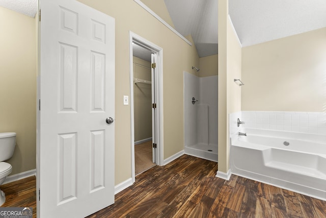 full bath with toilet, a garden tub, a shower stall, and wood finished floors