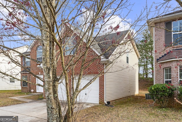 view of property exterior featuring a garage and driveway