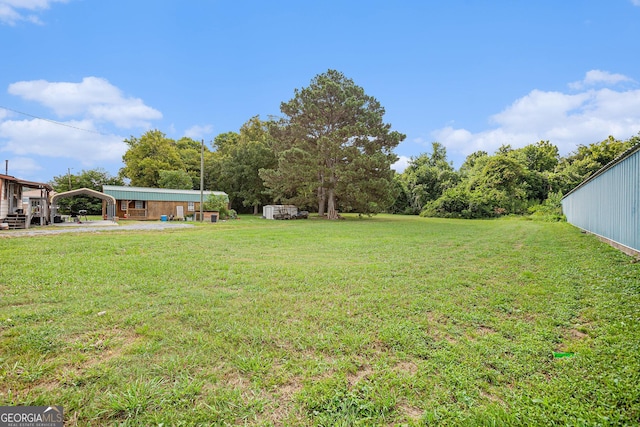 view of yard with a carport