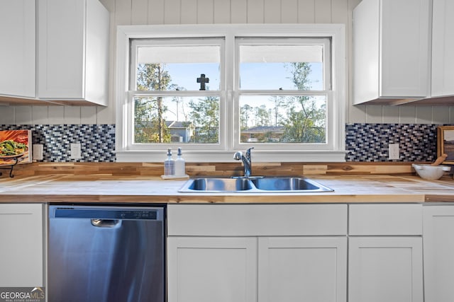 kitchen featuring a sink, wooden counters, white cabinets, and dishwasher