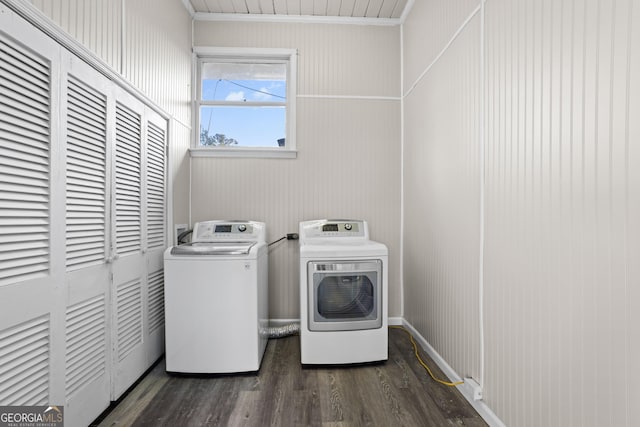 clothes washing area with laundry area, dark wood-style flooring, and washer and dryer