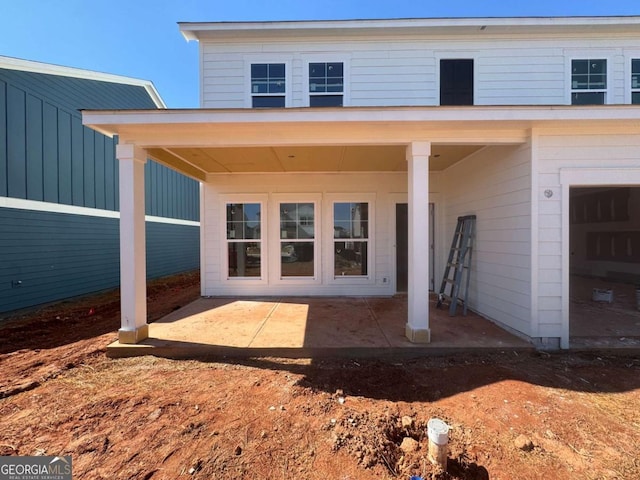 back of house with a patio area