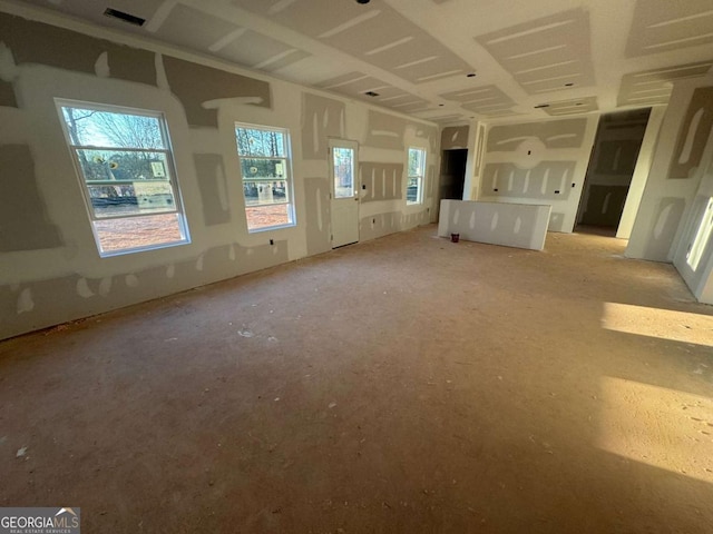 unfurnished living room featuring visible vents