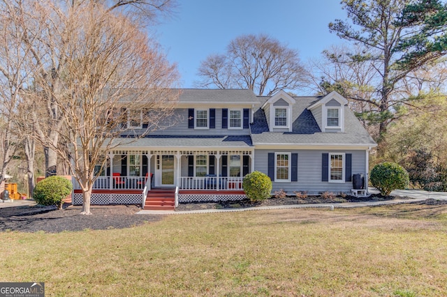 view of front facade featuring covered porch, a front lawn, and a shingled roof